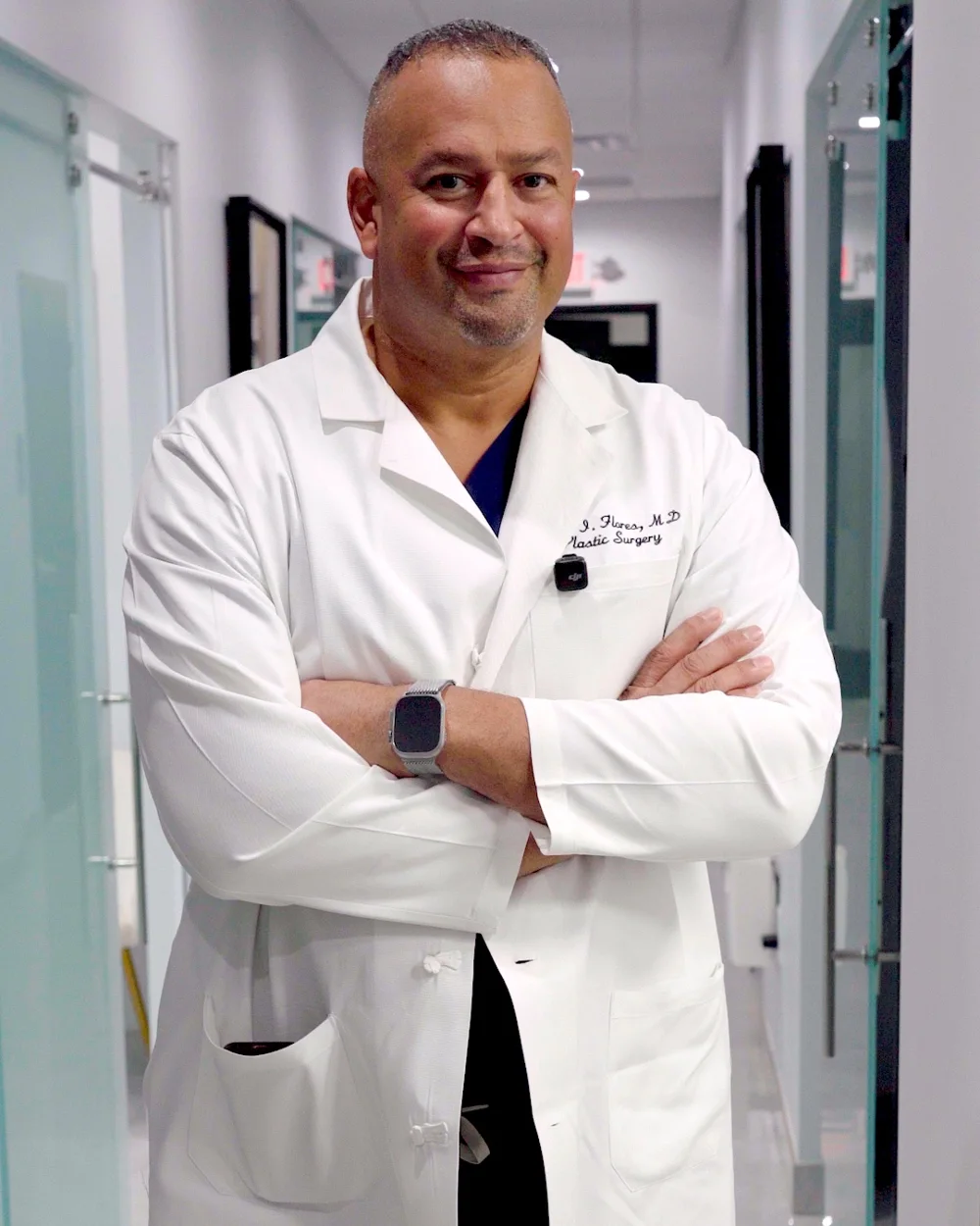 Dr. Jaime Flores, medical director at AWE, standing in the clinic hallway